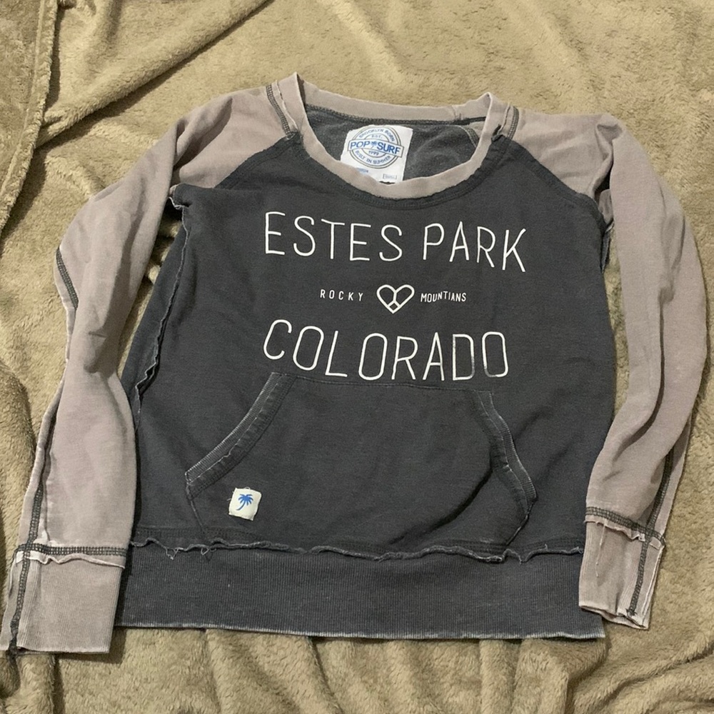 small, grey crew neck from a tourist shop in Estes Park